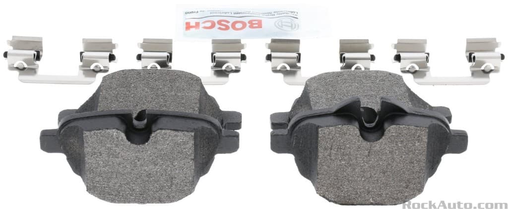 Disc brake pad set with hardware and lubricant